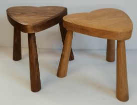 A pair of oak milking stools