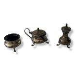 AN EARLY 20TH CENTURY SILVER THREE PIECE CRUET SET Comprising a salt pot, pepper pot and mustard,