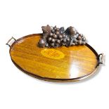 AN EDWARDIAN MAHOGANY AND SHELL INLAID TWO HANDLED TRAY Along with a carved mahogany grape vine. (