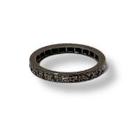 AN EARLY 20TH CENTURY WHITE METAL AND DIAMOND ETERNITY RING Set with a continuous row of round cut