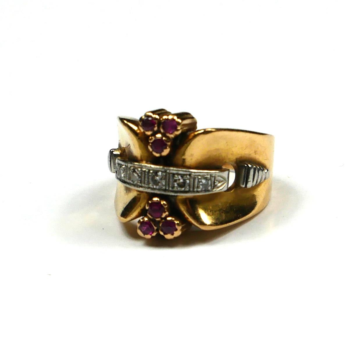 A VINTAGE 14CT GOLD, RUBY AND DIAMOND COCKTAIL RING The single row of round cut diamonds with two