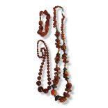 A COLLECTION OF VINTAGE CARNELIAN JEWELLERY To include a necklace with white metal mounts and a