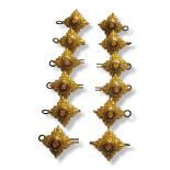 A COLLECTION OF EARLY 20TH CENTURY BRASS OFFICER'S RANK STAR PIPS Star form with red and green