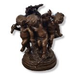 A LARGE BRONZE GROUP, PUTTI CELEBRATING HARVEST FESTIVAL Surrounded by grapes and vines, raised on a