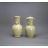 A Pair of olive glazed Jars and Covers, Song/Yuan dynasty the taller H: 25cm PROPERTY FROM THE COLIN
