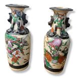 A PAIR OF EARLY 20TH CENTURY CHINESE EXPORT CRACKLE GLAZED STONEWARE BALUSTER VASES Both sides