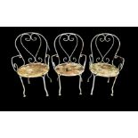 THREE SCROLLWORK WROUGHT IRON GARDEN CHAIRS. Condition: weathered/distressed