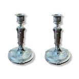 JULES PAUL BRATEAU, 1844 - 1923, A PAIR OF PEWTER CANDLESTICKS Classical form with embossed