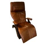 A ZERO GRAVITY, PERFECT TAN LEATHER CHAIR Model PC410-105-001, on walnut supports. (78cm x 112cm x