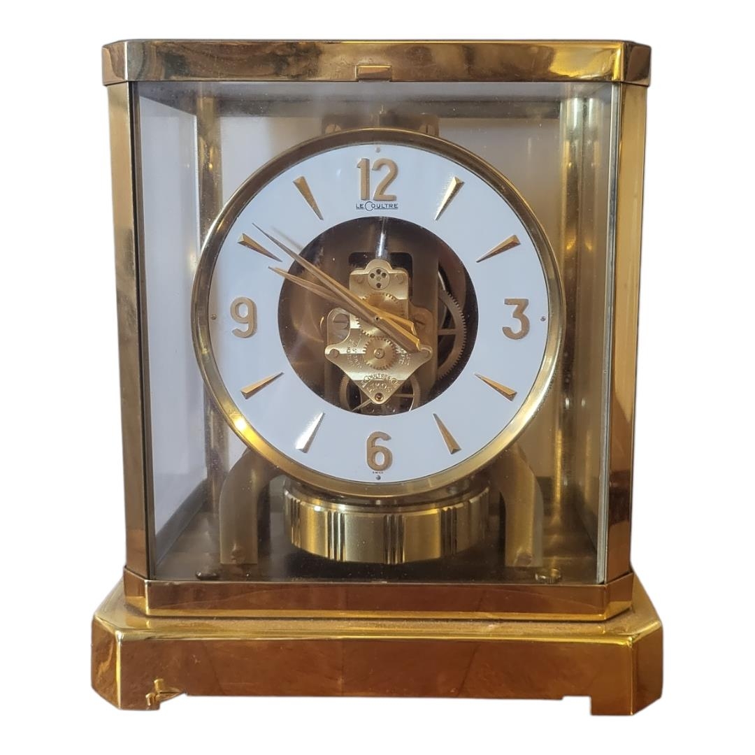 JAEGER LECOULTRE, A GILT BRASS AND GLASS ATMOS CLOCK Model 528-8, marked ‘89199’ to base. (h 24cm)