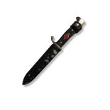 AN EARLY 20TH CENTURY GERMAN BONNIE YOUTH KNIFE Metal mounted, ebonised hilt, metal scabbard, the