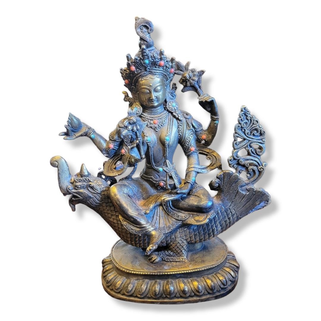 A SINO-TIBETAN CAST BRONZE GOLD SPLASHED FIGURE OF DEITY SAKYAMUNI Seated on Tibetan mythological