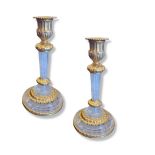 A PAIR OF LOUIS XV STYLE ROCK CRYSTAL AND GILT METAL ORMOLU MOUNTED CANDLESTICKS With reeded