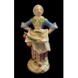 MEISSEN, AN EARLY 20TH CENTURY PORCELAIN MODEL OF A FEMALE FISH SELLER AFTER CRIES OF PARIS Modelled