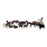 BESWICK, THREE POTTERY MODELS OF WELSH MOUNTAIN PONIES In dark brown gloss, five Beswick models of