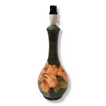 MOORCROFT, AN ORIGINAL BOTTLE FORM LAMP BASE Tubelined with stylised flowerheads in shades of ochre,