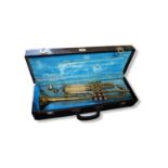 A B&M CHAMPION BRASS TRUMPET With two mouthpieces, in hard carry case. (case 55cm x 18cm x 12cm)