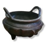 AN ASIAN BRONZE CENSER With white metal inlaid decoration on ribbed body, bearing seal mark. (