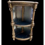A 19TH CENTURY BOW FRONTED GILT CORNER SHELF With acanthus fluted columns, plate mirrored panel