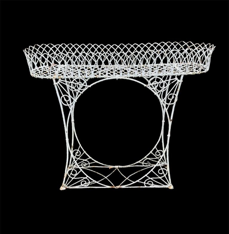 A GEORGIAN DESIGN WIREWORK PLANTER With Gothic lattice work basket top. (109cm x 29cm x 101cm)