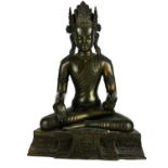 A CHINESE BRONZE FIGURE OF BUDDHA SAKYAMUNI In a seated pose with one hand open and one closed. (
