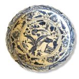A LARGE 20TH CENTURY CHINESE EXPORT HARD PASTE BLUE AND WHITE PORCELAIN CHARGER In Swatow style,