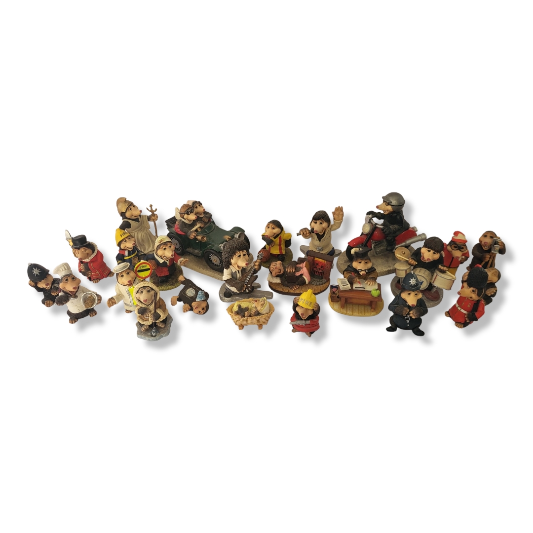 A COLLECTION OF TWENTY-FOUR THE MILLENIUMS DOVERDALE DESIGN AMUSING NOVELTY COMPOSITION FIGURES,