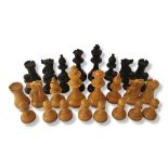 AN EARLY 20TH CENTURY STAUNTON PATTERN WEIGHTED BOXWOOD AND EBONY COMPLETE CHESS SET In original