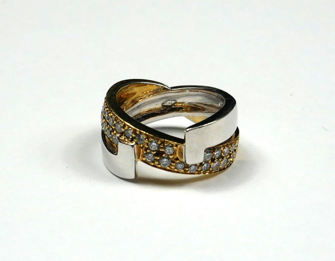 AN 18CT BICOLOUR GOLD AND DIAMOND HALF TWIST RING Two rows of round cut diamonds on a yellow gold - Image 2 of 4
