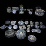 WEDGWOOD, A BLUE JASPERWARE COLLECTION OF ELEVEN TRINKET BOXES AND COVERS Eighteen small trays,