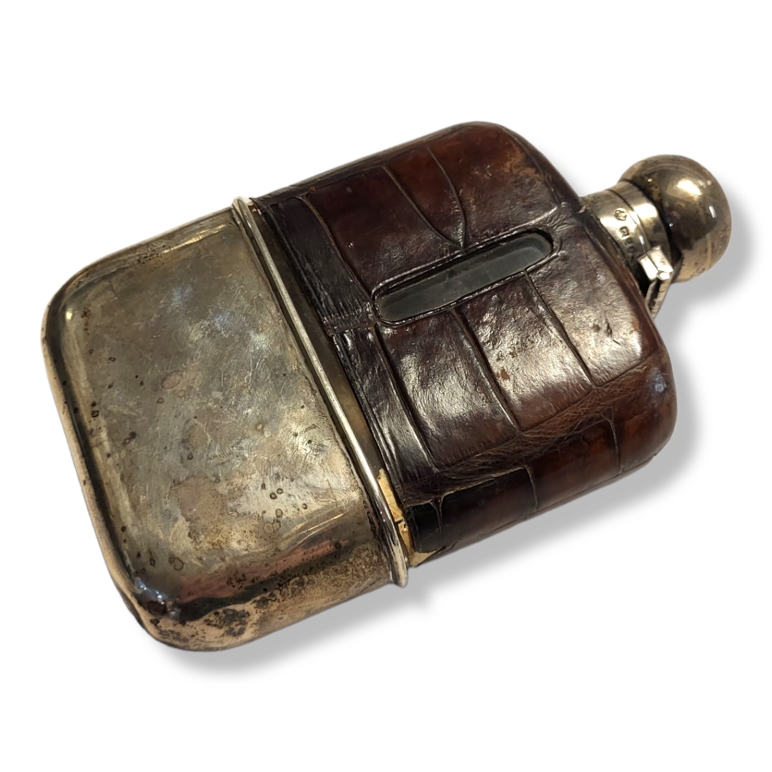 A VICTORIAN SILVER AND CROCODILE SKIN HIP FLASK Having a screw cap, the glass bottle clad with - Image 2 of 2