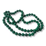 A CARVED MALACHITE BEAD BECKLACE The single row of spherical beads. (approx 43cm, each bead approx
