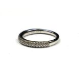 VERA WANG, AN 18CT WHITE GOLD AND DIAMOND HALF ETERNITY RING Having two rows of round cut