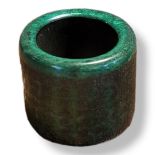 A 20TH CENTURY GREEN GLAZED JADE ARCHERS RING Bearing Chinese inscription. (h 3cm)