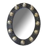 A BOAR TUSK, BRASS AND FAUX MARBLE OVAL MIRROR Set with twelve tusks in circular brass mounts on