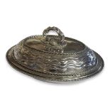 OMAR RAMSDEN, 1873 - 1939, A SILVER OVAL ENTRÈE DISH AND COVER With Tudor rose finial handle, wave