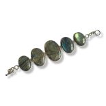 A WHITE METAL AND INDIAN LABRADORITE MOONSTONE BRACELET Five graduated cabochon cut oval cut stones.
