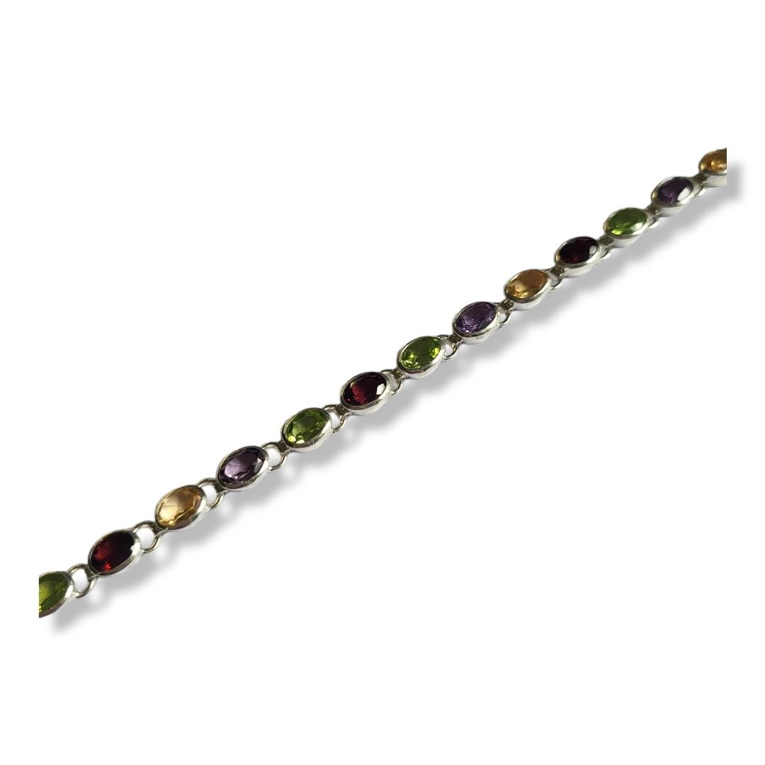 A WHITE METAL AND GEMSTONE 'TUTTI FRUTTI' BRACELET Having a row of oval cut stones including - Image 2 of 2