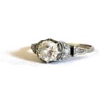 AN EARLY 20TH CENTURY WHITE METAL AND DIAMOND SOLITAIRE RING Having a single round cut diamond in an