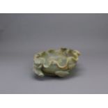 A Large Ming style Jade lotus leaf Brushwasher, 19th/20th century L: 21.5cm, W: 18.5cm the sage