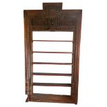 AN EARLY 20TH CENTURY CARVED ASIAN HARDWOOD DOOR FRAME with foliage and spindles, now converted to