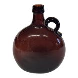 A VINTAGE AMBER GLASS FLAGON DECANTER/BOTTLE Facing a single handle and oval body. (approx 17cm x