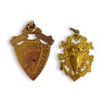TWO EARLY 20TH CENTURY 9CT GOLD WATCH FOBS Having a pierced shield design and engraved