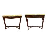 A PAIR OF MID 20TH CENTURY ITALIAN MAHOGANY CONSOLE TABLES The serpentine marble tops on fluted