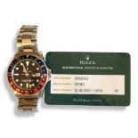 ROLEX, OYSTER PERPETUAL GMT, A VINTAGE STAINLESS STEEL GENT’S WRISTWATCH Having a red and blue '