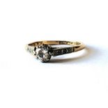 AN 18CT GOLD AND DIAMOND SOLITAIRE RING The round cut diamond with diamond set shoulders. (approx