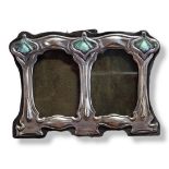A SMALL ART NOUVEAU STYLE STERLING SILVER DOUBLE PHOTOGRAPH FRAME With light green enamel