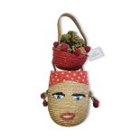 LULU GUINNESS, A VINTAGE STRAW 'CARMEN MIRANDA HANDBAG Having a floral basket and embroidered facial