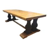 A LARGE PINE REFECTORY TABLE The plank top raised on four heavy faux stone balusters standing on