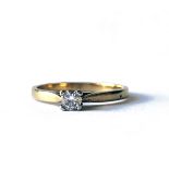AN 18CT GOLD AND DIAMOND SOLITAIRE RING Set with a round cut diamond on a plain shank. (approx